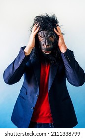 Man In A Suit And With A Gorilla Mask.