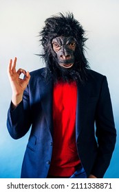 Man In A Suit And With A Gorilla Mask.