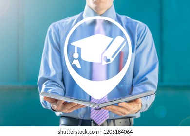 Man In A Suit Holding A Open Book With Map Pin And Graduation Cap With Pencil Icon. Learning Education Business Concept.