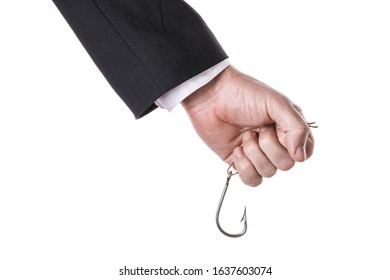 A Man In A Suit Holds A Fishing Hook Tightly In His Hand Isolated On A White Background. Concept On A Hook