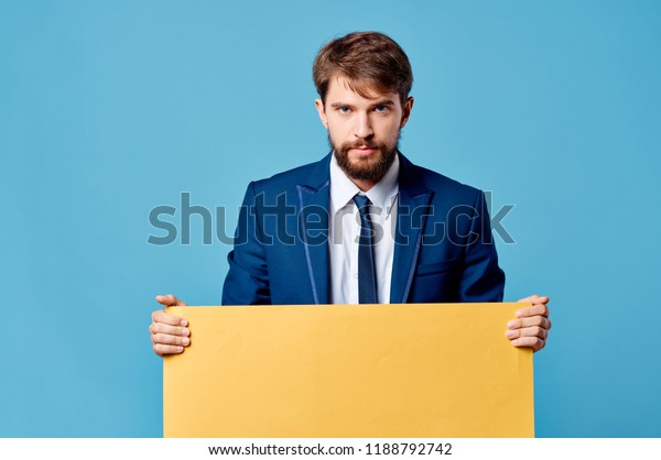 Download Man Suit Holds Yellow Mockup Stock Photo Edit Now 1188792742