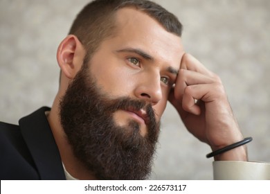 Man In A Suit With A Long Beard