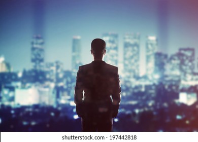 man in suit looking to night city