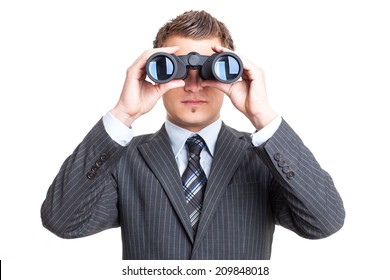 Man in suit looking through binoculars