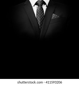 man in suit on a black background. studio shot - Shutterstock ID 411593206