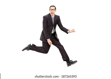 Man In Suit Playing Air Guitar Isolated On White Background