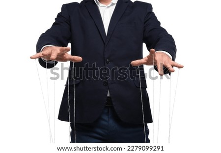 Man in suit pulling strings of puppet on white background, closeup