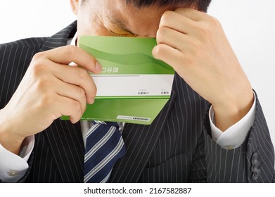 A Man In A Suit With A Savings Passbook Written As 