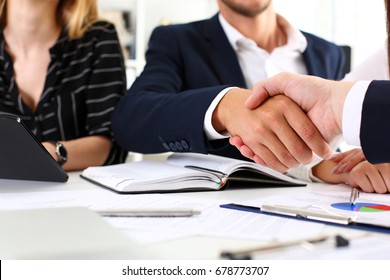 Man in suit shake hand as hello in office closeup. Friend welcome, mediation offer, positive introduction, greet or thanks gesture, summit participate approval, motivation, strike arm bargain concept