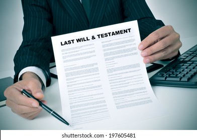 Man In Suit Showing Where The Testator Must Sign In A Last Will And Testament Document