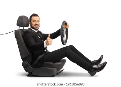 Man In A Suit Sitting In A Carseat Holding The Steering Wheel And Showing Thumbs Up Isolated On White Background