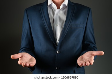 The man in the suit stretches his palms forward - Powered by Shutterstock