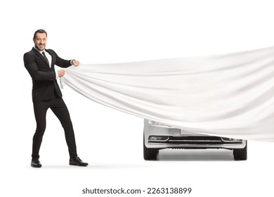Man in a suit and tie presenting a new car isolated on white background - Shutterstock ID 2263138899