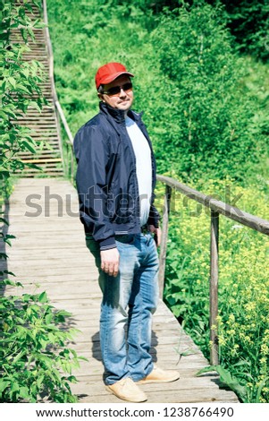 Similar – Portrait of a young man in the bamboo jungle