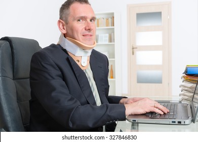 Man with a surgical cervical collar suffering from neck pain at work