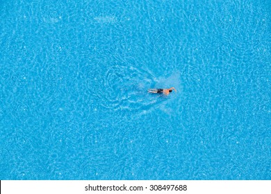 Man Swim In The Pool At The Hotel. View From Above. 