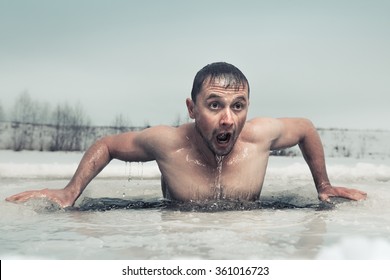 Man Swimming In The Ice Hole With Emotional Face