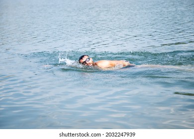 Man Swimming In Open Water Lake