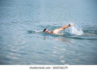 Man Swimming In Open Water Lake