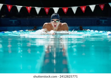 Man, swimming pool and exercise for sport with splash, speed and training for wellness, health and fitness. Swimmer, athlete or person in water for games, contest or workout with goggles in summer - Powered by Shutterstock