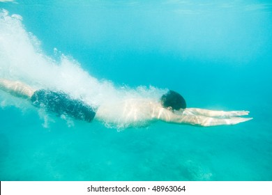 Man Swimming Under Water, Just Jumped In.