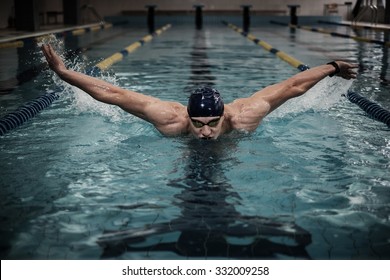 Man swims using breaststroke technique 