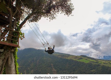 Man Swinging On Swing In Baños Ecuador.