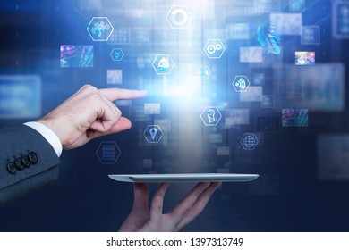 Man with tablet computer using digital business interface. Concept of telecommunication, IoT, big data and coding. Toned image double exposure blurred