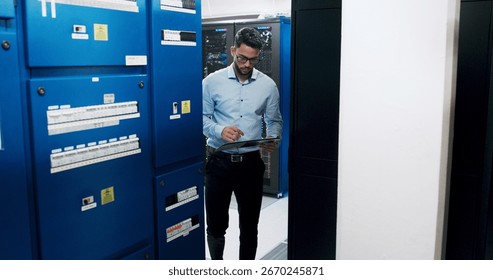 Man, tablet and programmer for inspection in server room, scroll and checklist for IT solution at company. Person, cybersecurity and system assessment with tech, app and information technology career
