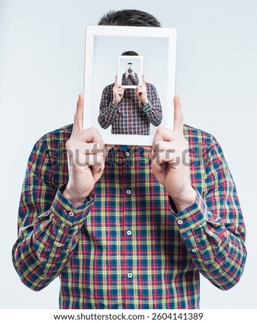 Man, tablet and recursive screen in studio for futuristic illusion, droste effect and infinity on white background. Digital technology, frame and cover face for surreal photography, repeat or selfie