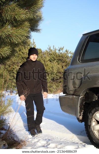A man in tactical clothes near the car. Special\
operations. Military. Police