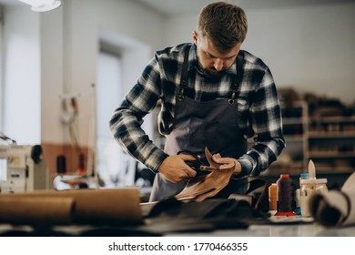 Man Tailor Working With Leather Fabric