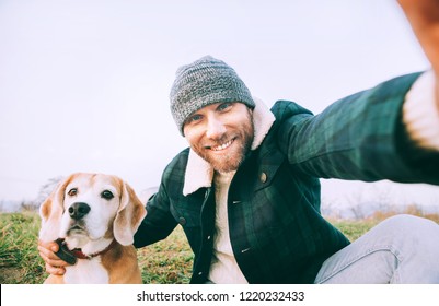 Man takes selfie photo with his best freind beagle dog - Powered by Shutterstock