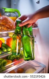 Man Taking Beer From A Fridge