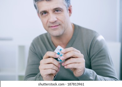 Man Taking Medication