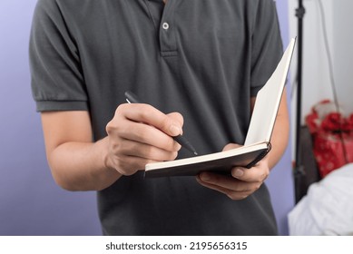Man taking notes in notebook