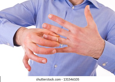 Man Taking Off His Golden Wedding Ring.