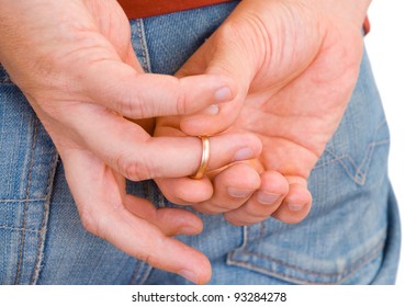 Man Taking Off His Golden Wedding Ring