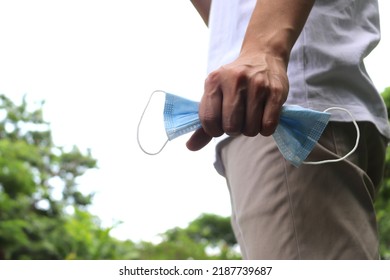 Man Taking Off Mask, Back Into Normal Life.