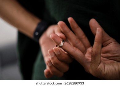 Man Taking Off The Wedding Ring Behind His Back, Cheating on Wife