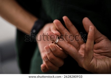 Man Taking Off The Wedding Ring Behind His Back, Cheating on Wife
