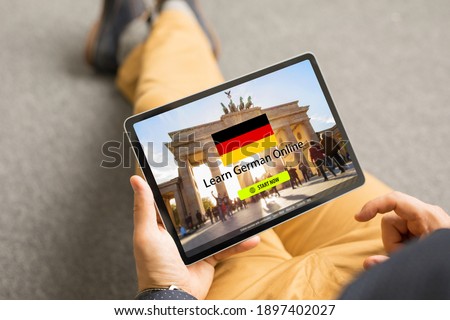 Man taking online courses and learning German language