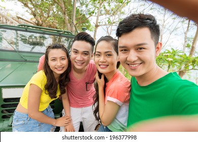 Man taking photo of himself and his friends