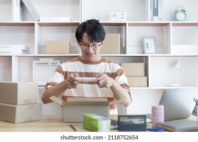 Man Taking A Photo Of Product In Box Postbox With A Mobile Phone Or Selfie, Identity Verification Or Order Confirmation, Business Style For Working At Home, Working At Home And Owning Businesses.