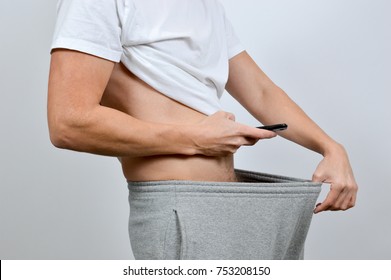 Man Taking A Picture Of His Penis With A Smart-phone. A So-called Dick Pic
