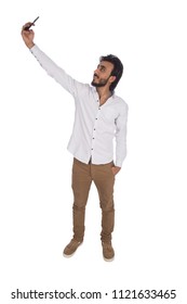 man taking selfie in casual wear in full length shot , isolated in white background
