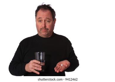 Man taking two pills with a glass of water for a headache on a White Background.