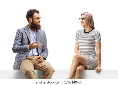Man talking to a blond woman seated on a panel isolated on white background