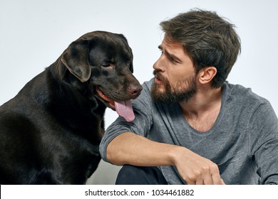 A Man Talking To A Dog                             