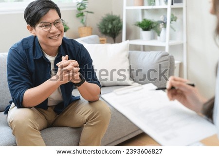 Man talking with mentor psychologist in therapy mental health anxiety session.